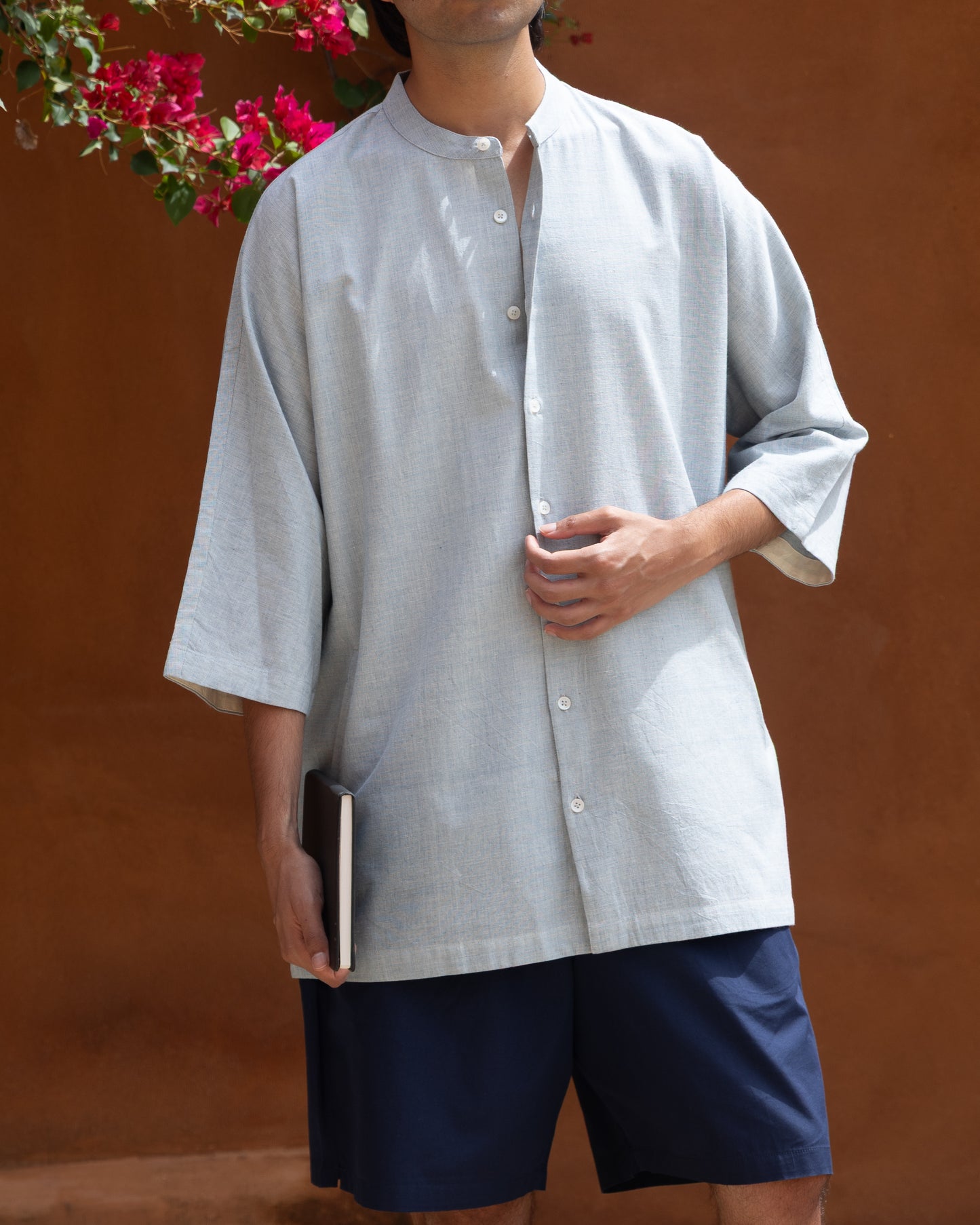 Light pastel blue kimono-style shirt for men made from handloom Khadi cotton, featuring quarter-length sleeves and eco-friendly fabric.