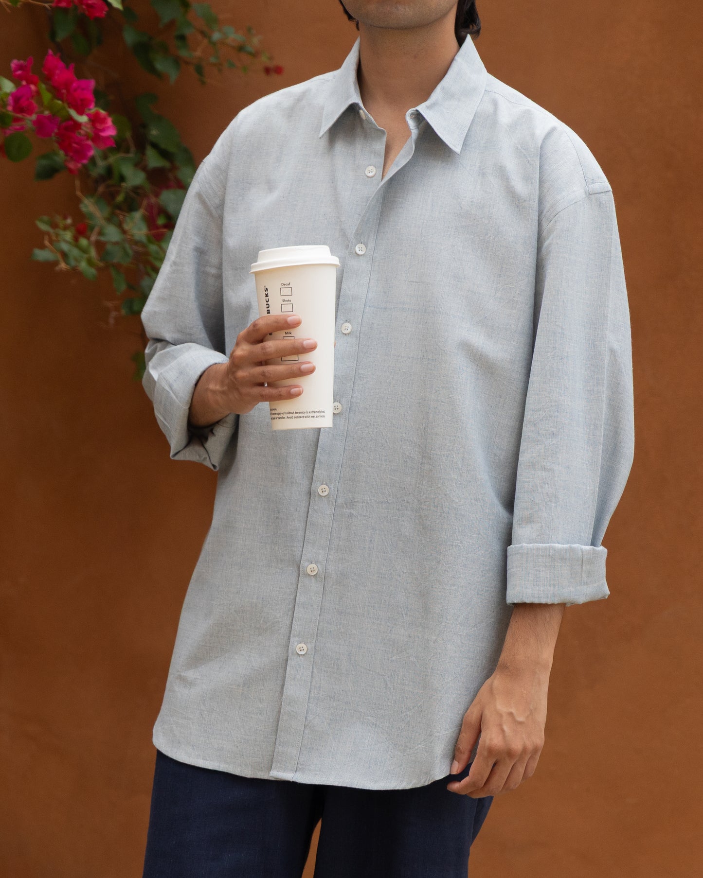 Men's baby blue Khadi cotton shirt, relaxed fit with handloom craftsmanship, organic and eco-friendly fabric, pastel earthy tone, lightweight and stylish Japanese-inspired design, ideal for conscious fashion choices.