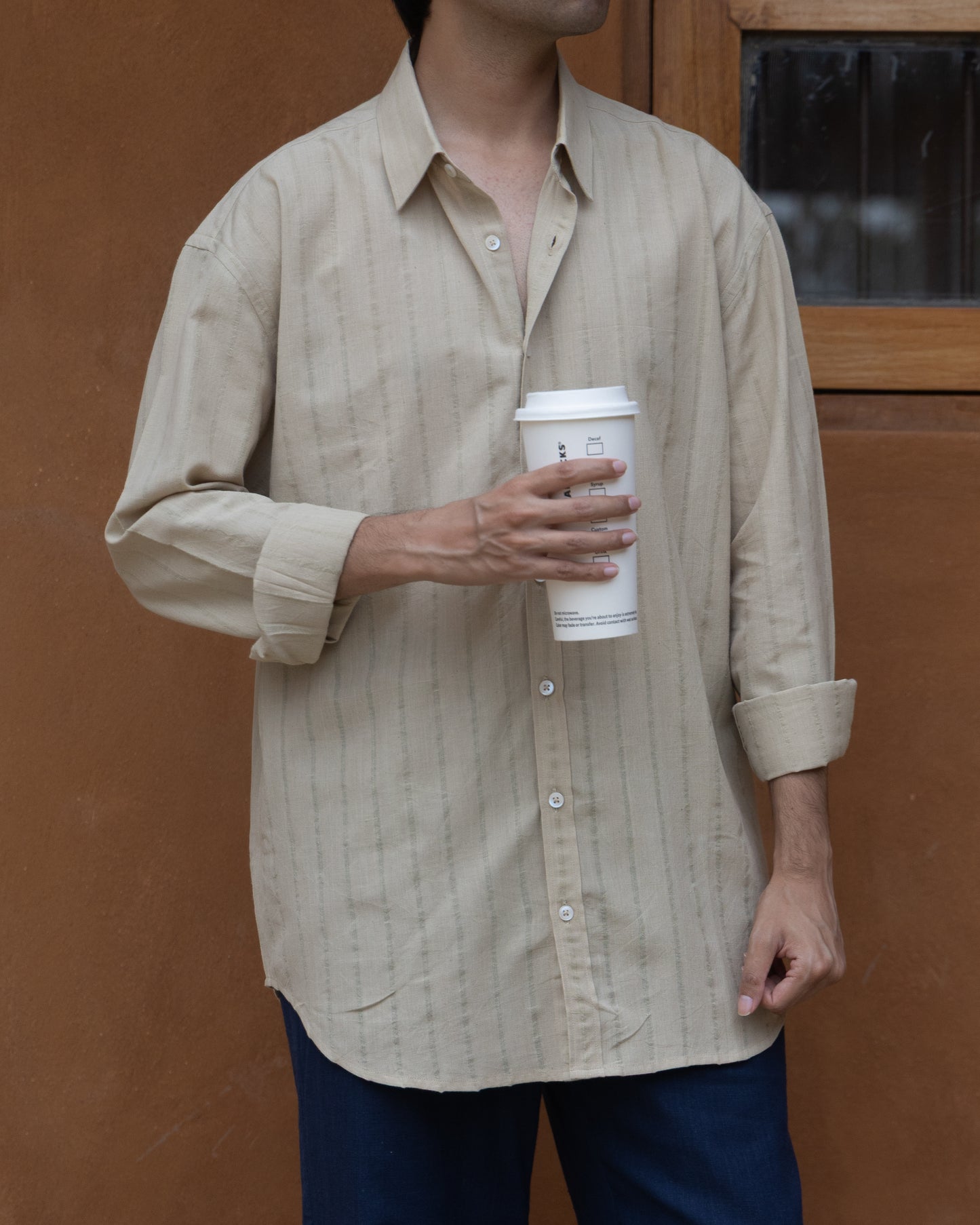 Relaxed fit khadi cotton shirt for men in basil green, handwoven with an earthy tone and breathable organic fabric.