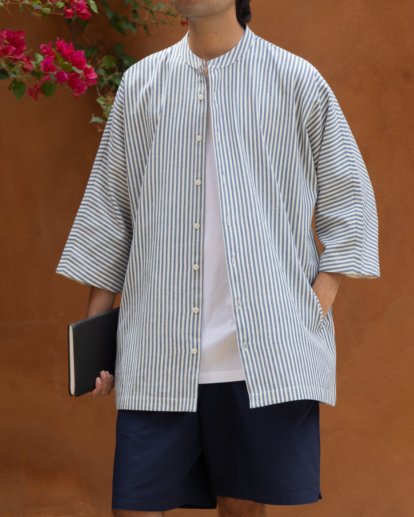 Limited edition Khadi cotton blue stripes kimono shirt for men, with traditional handloom texture and eco-conscious materials.