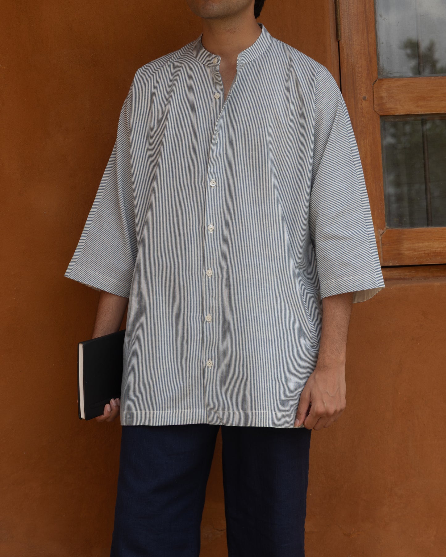 Capri blue striped khadi cotton kimono shirt for men with 3/4 sleeves, handwoven using traditional handloom techniques.