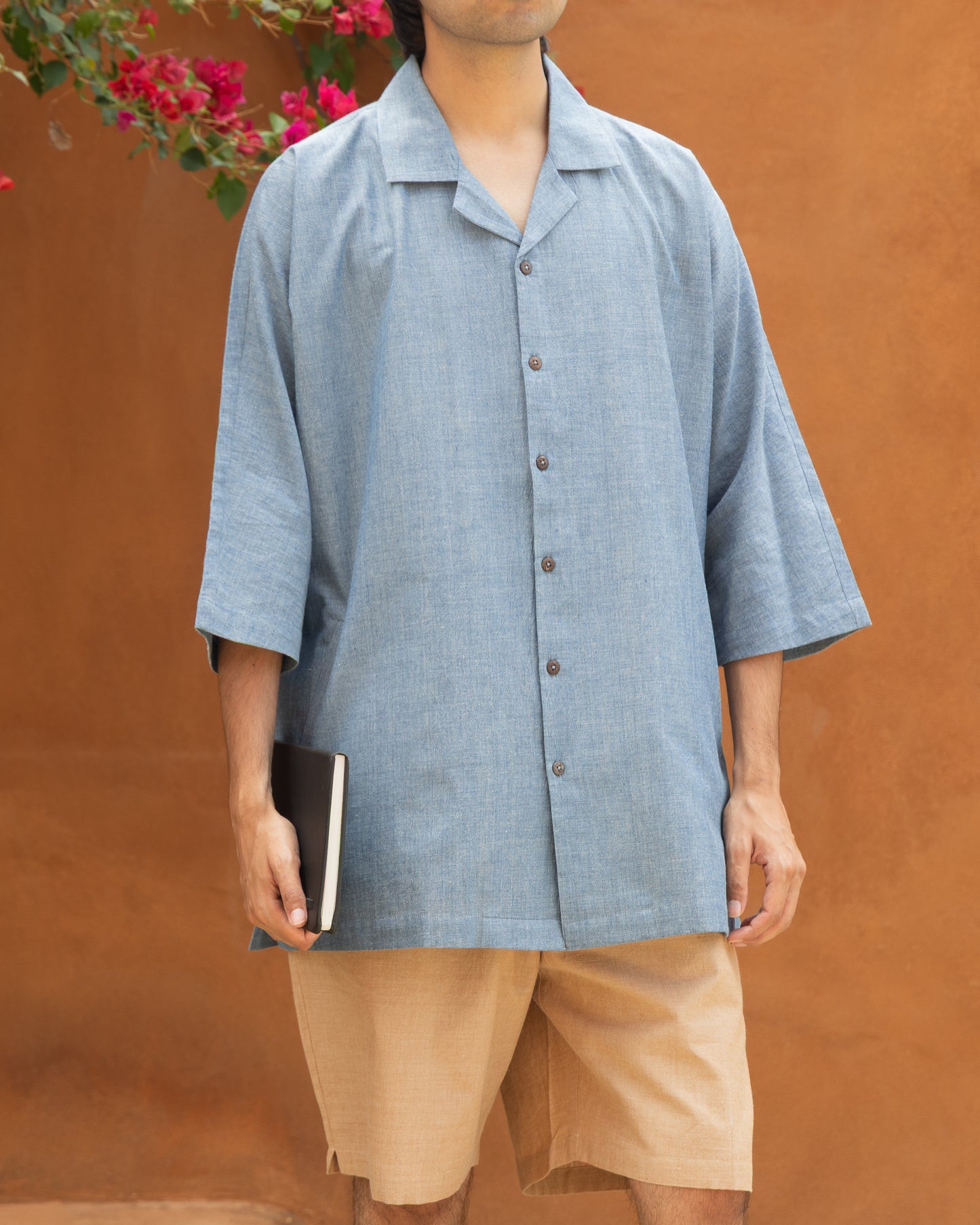 Khadi cotton shirt in pastel chambray blue with kimono sleeves and 3/4 length, ideal for earthy and sustainable men’s fashion.