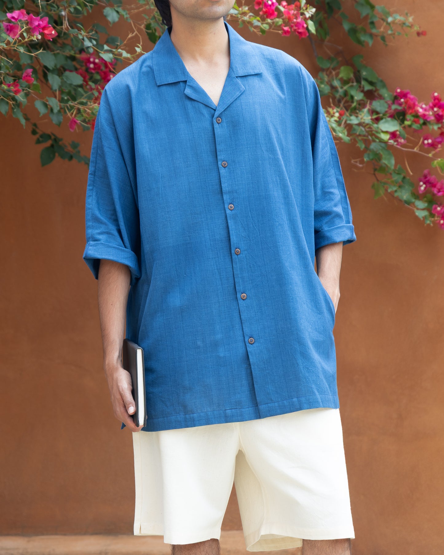 Organic Khadi shirt for men in indigo tone, featuring a relaxed fit, kimono sleeves, and a minimalist camp collar—perfect as a luxury earthy shirt.