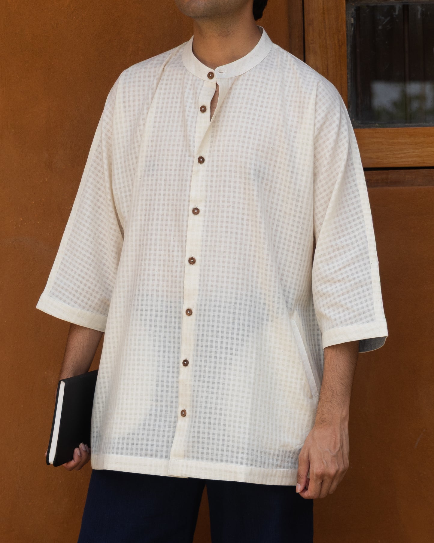 Ecru khadi cotton kimono shirt for men with subtle self-check texture and 3/4 sleeves, crafted from handwoven organic fabric.