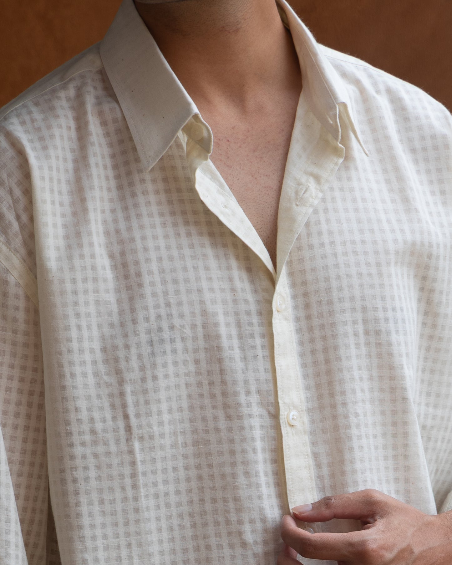 Eco-friendly relaxed fit shirt in light ecru, featuring handspun khadi cotton and a textured self-check weave for a minimal earthy look.