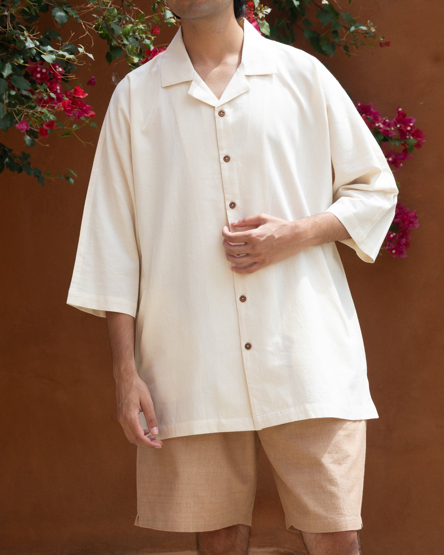 Men's organic cotton Khadi shirt in natural undyed shade, featuring Japanese-style camp collar and handloom fabric with kimono sleeve design.