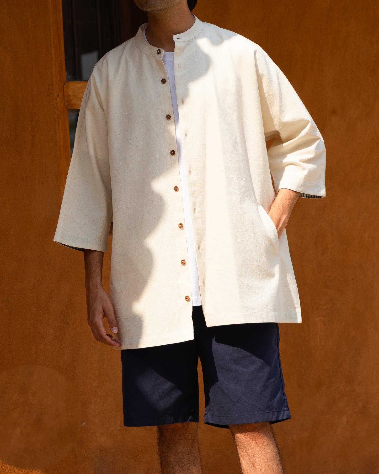Men's undyed soft cream Khadi cotton kimono sleeve shirt, light earthy tone, crafted from organic cotton and handloom fabric.