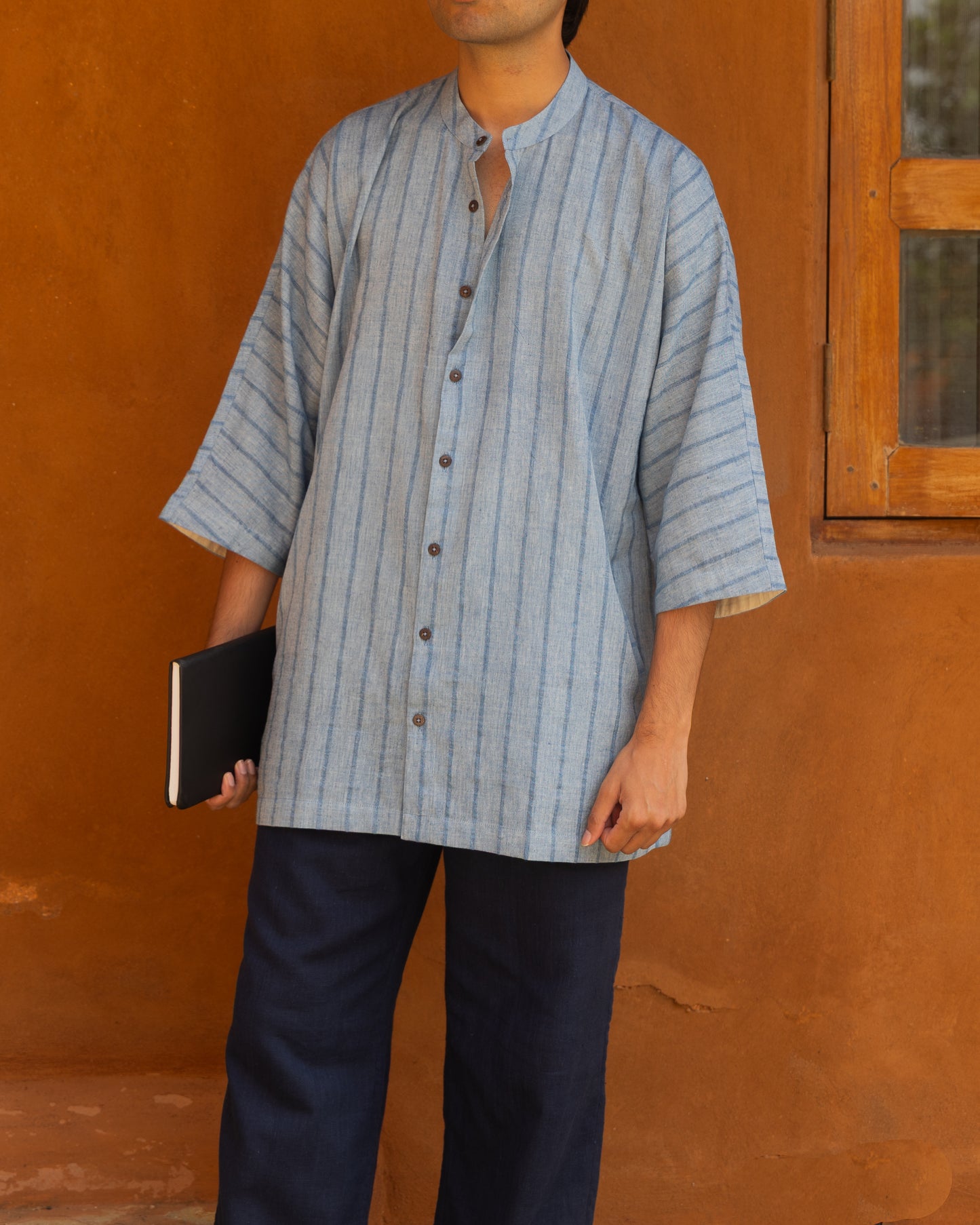 Handwoven Indigo Scar Kimono Shirt for men made from organic khadi cotton with 3/4 kimono sleeves in a relaxed Japanese-inspired silhouette.