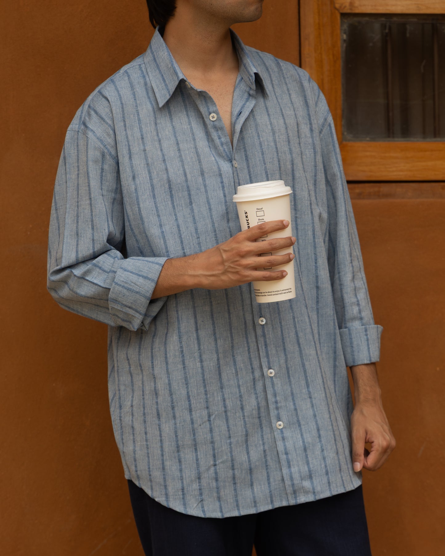 Deep indigo khadi cotton shirt for men with a relaxed fit, handwoven using traditional techniques for an earthy, organic look.