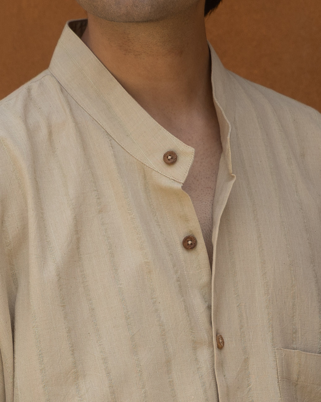Men’s long khadi kimono shirt in basil green with a soft, eco-friendly finish, 3/4 sleeves, and a loose, comfortable fit.