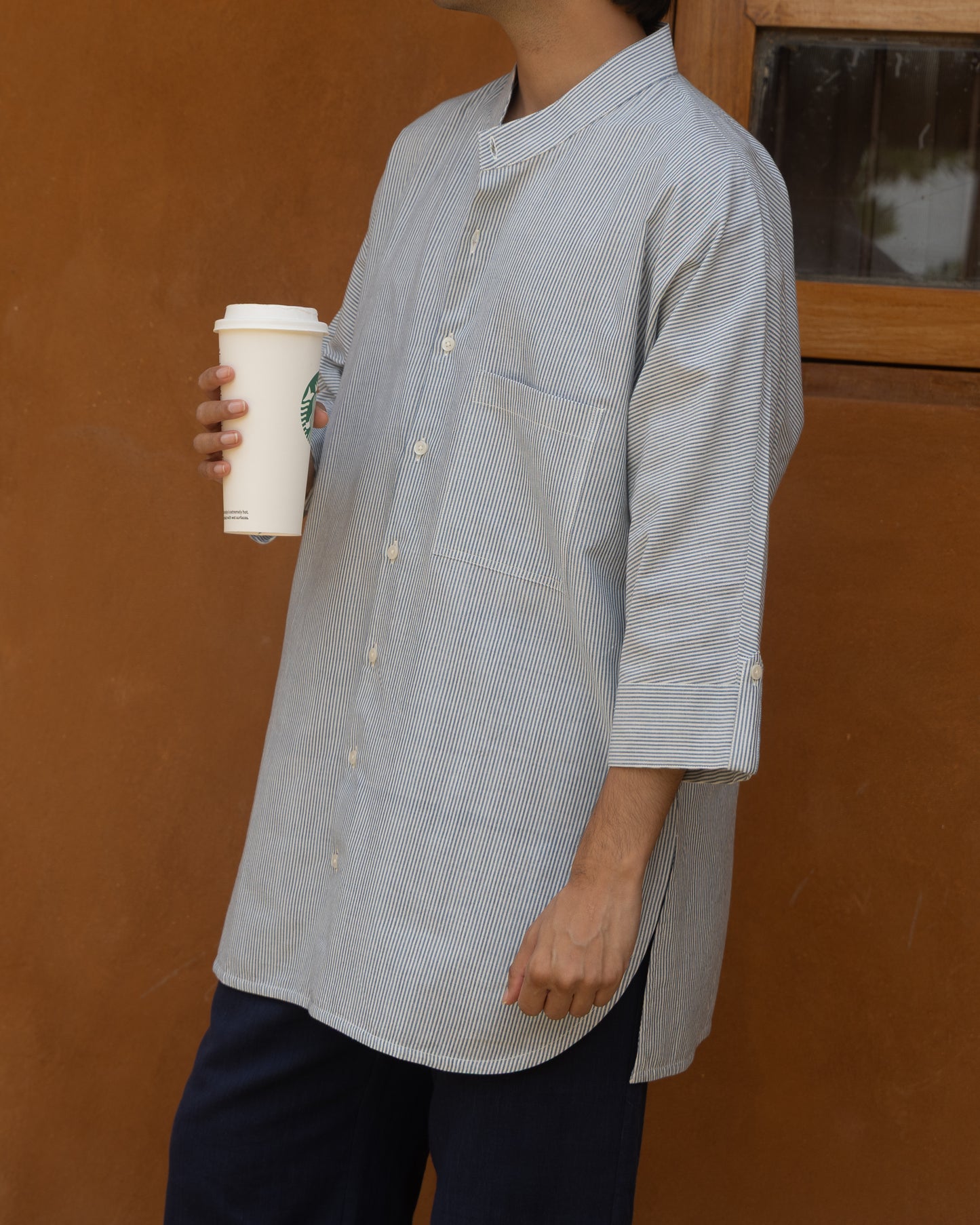 Pastel blue long kimono shirt for men made from handspun khadi cotton, featuring quarter sleeves and Japanese-inspired styling.