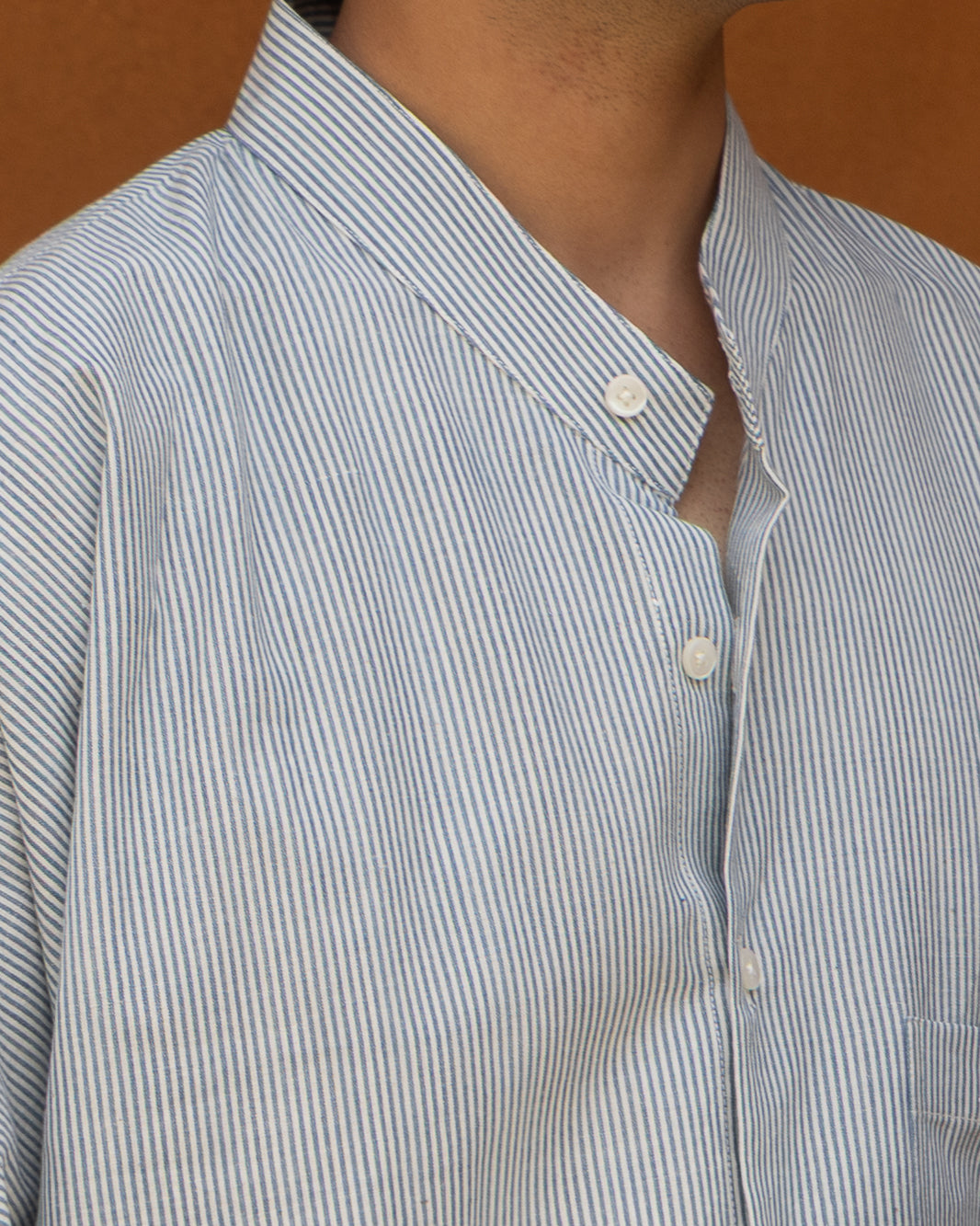 Eco-friendly kimono shirt for men in soft capri blue tones, crafted from handloom cotton with a relaxed fit and earthy design.