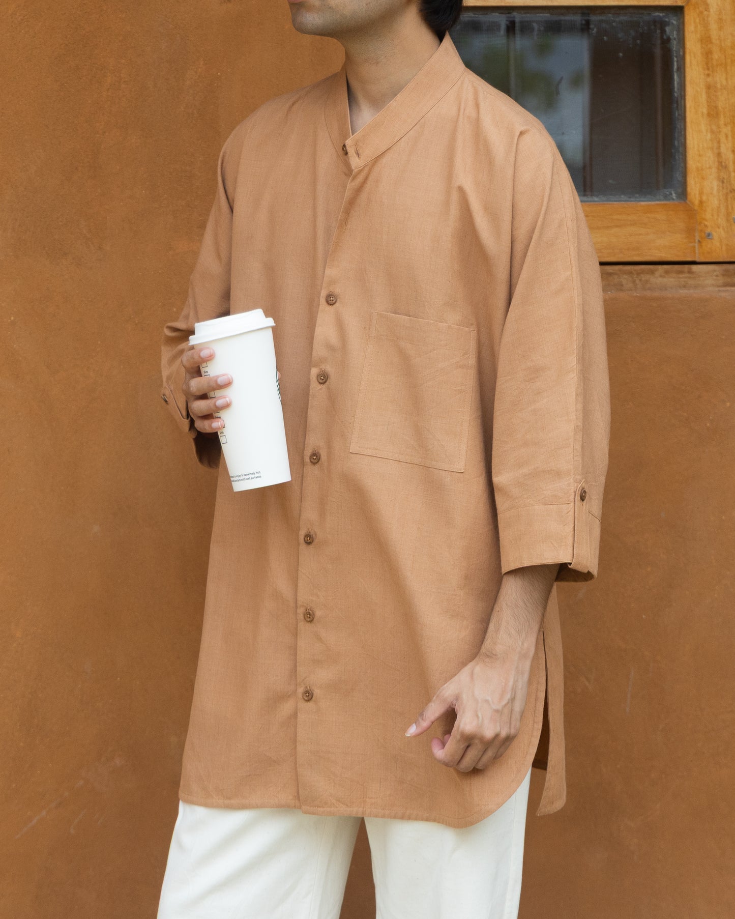 Caramel brown khadi cotton long kimono shirt for men with 3/4 sleeves, handcrafted using traditional handloom techniques.