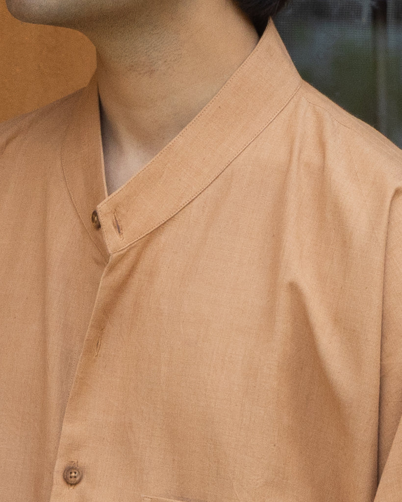 Men’s kimono-type shirt in rich caramel brown tones, crafted from handloom khadi cotton with a soft drape and relaxed quarter-sleeve design.