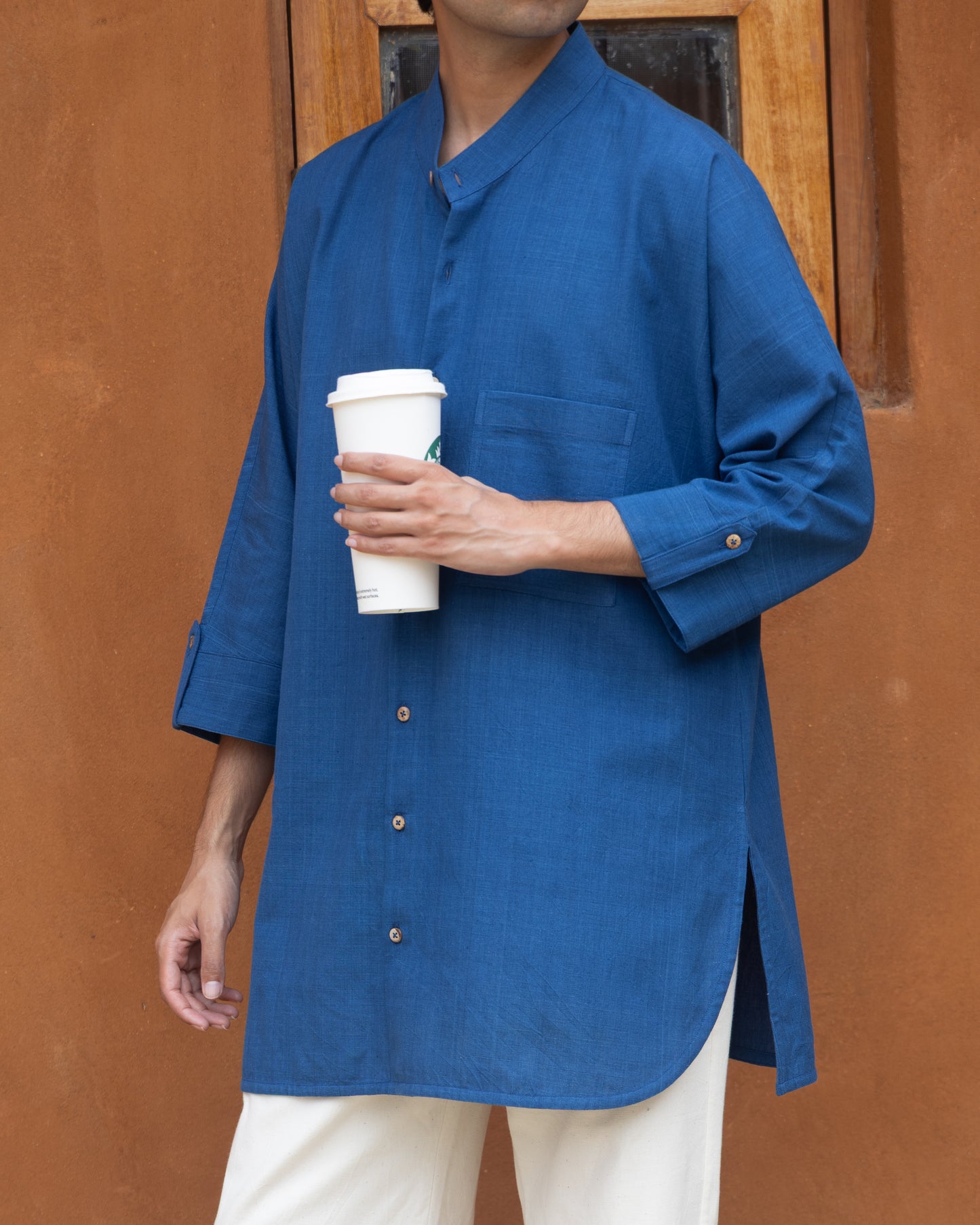 Deep blue khadi cotton long kimono shirt for men with 3/4 sleeves, handcrafted from handwoven organic fabric in a relaxed fit.