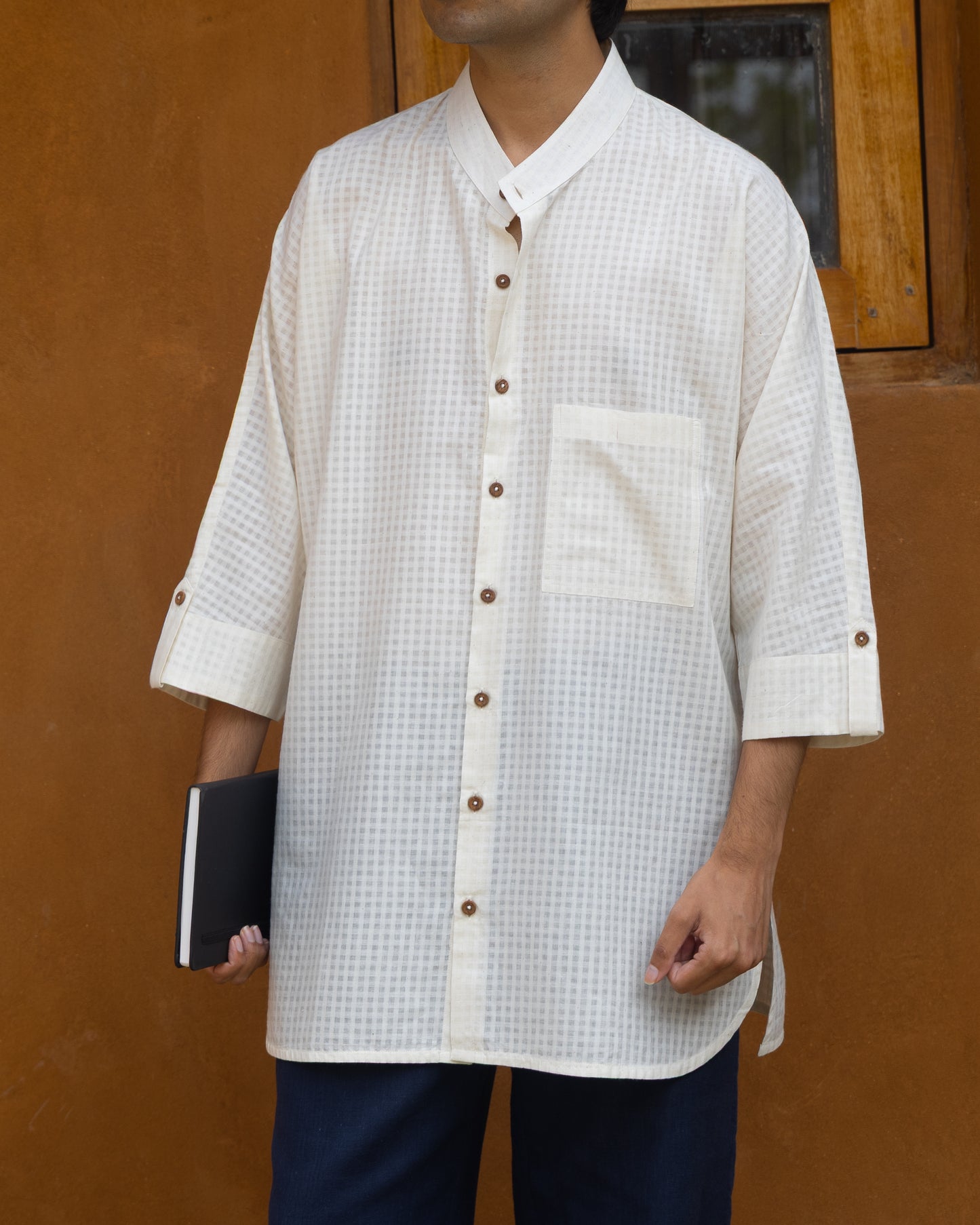 Ecru khadi cotton long kimono shirt for men with 3/4 sleeves and self-check pattern, crafted from handwoven organic fabric.
