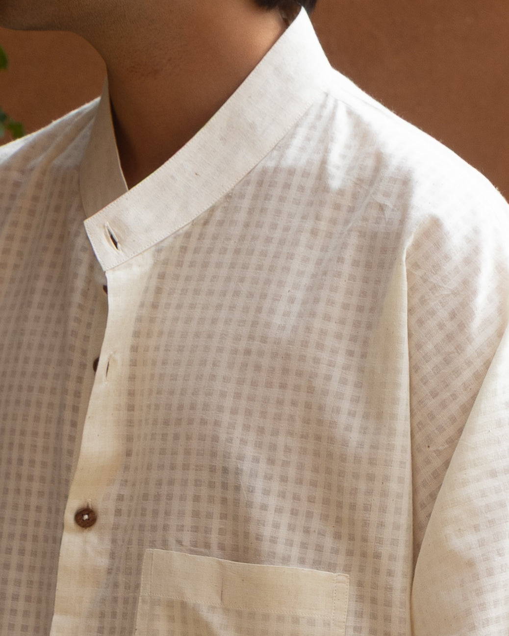 Handwoven long kimono shirt for men in earthy ecru tones, featuring organic cotton fabric, self-check weave, and a soft drape.