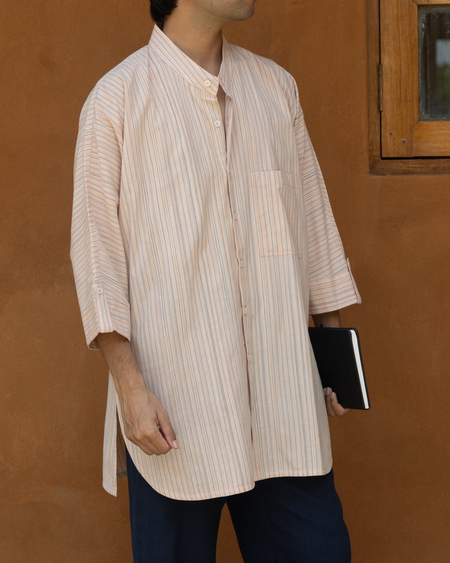 Soft pink striped khadi cotton kimono shirt for men with 3/4 sleeves, handwoven from organic fabric in a relaxed Japanese-inspired fit.