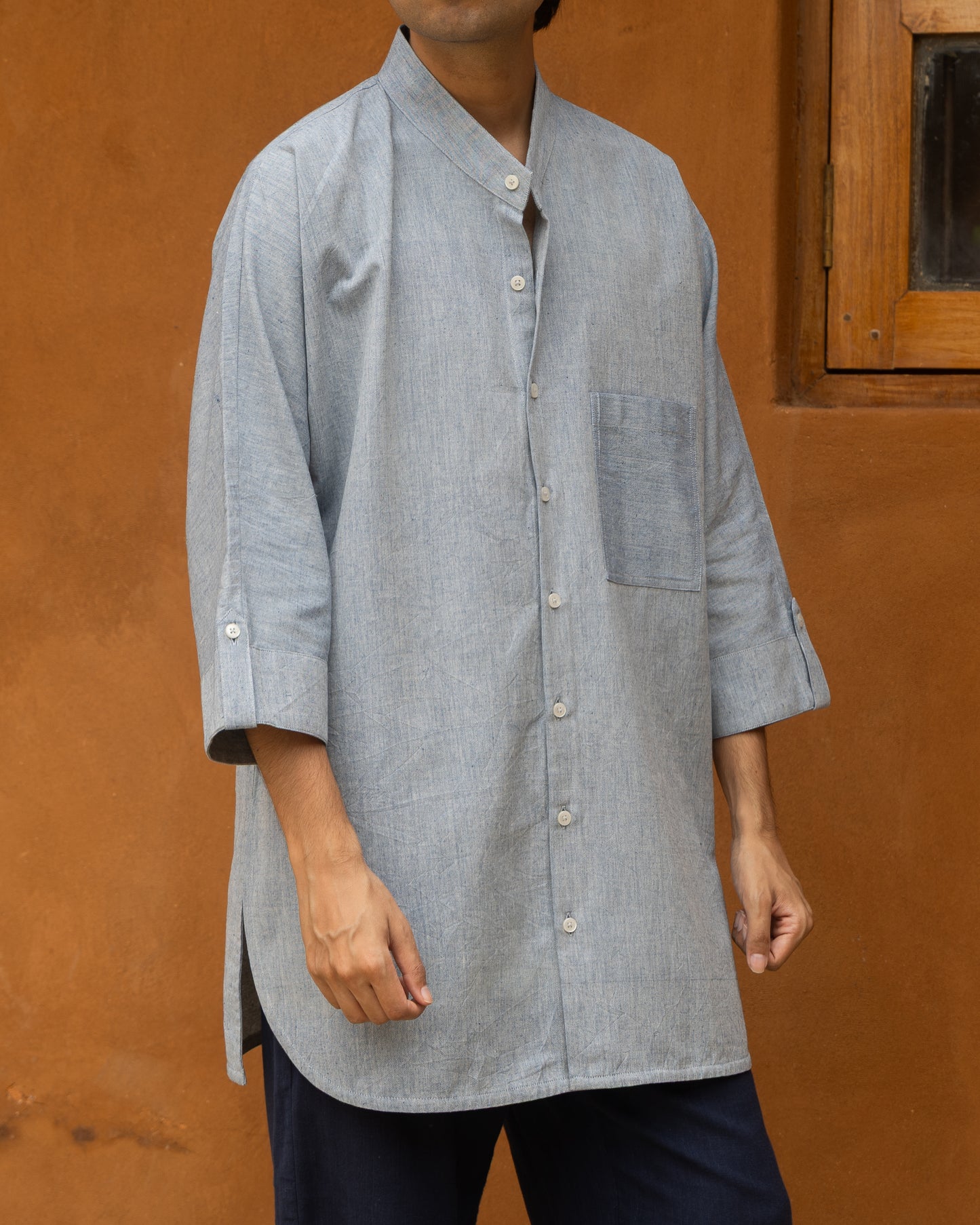 Pastel indigo kimono-style shirt for men, crafted from breathable handspun khadi cotton with a soft texture and quarter-length sleeves.