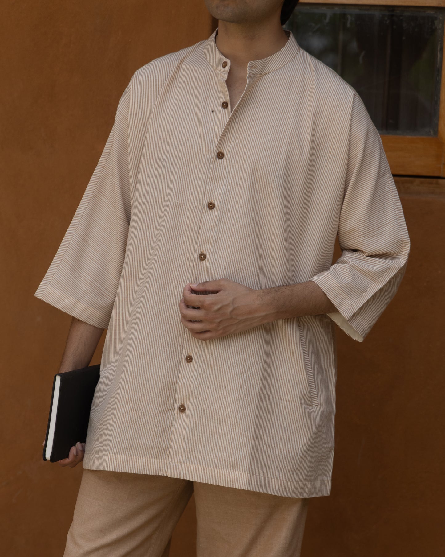 Handwoven khadi shirt for men in nutbrown tones with Japanese-inspired kimono sleeves and breathable organic cotton fabric.