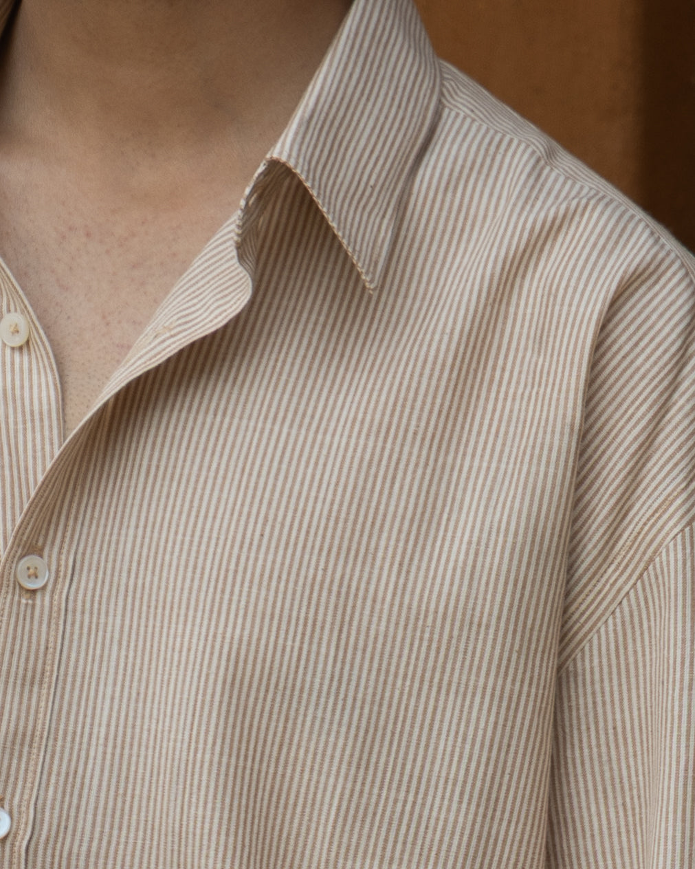 Nutbrown striped organic cotton shirt with a loose, comfortable fit for men, crafted from eco-friendly handspun and handwoven fabric.