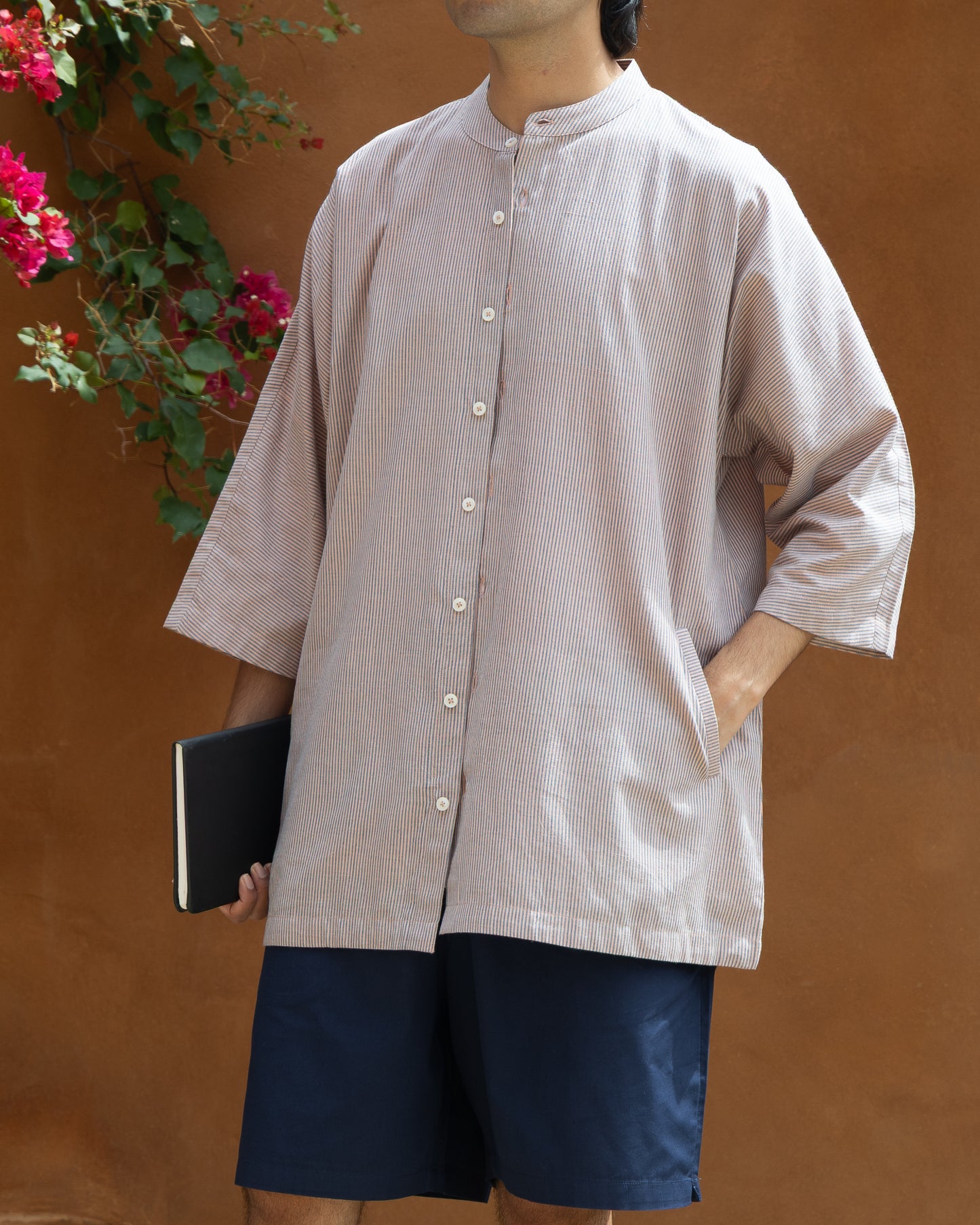Handloom Khadi shirt for men in soft violet stripes, featuring kimono-style sleeves and crafted from eco-friendly organic cotton.