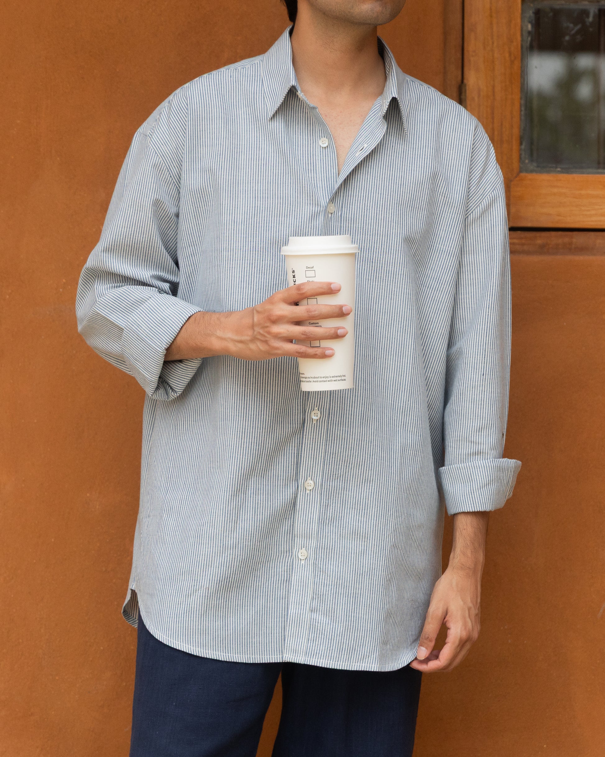 Pastel blue striped khadi cotton shirt for men with a relaxed fit, handwoven from organic fabric for an airy, eco-friendly feel.