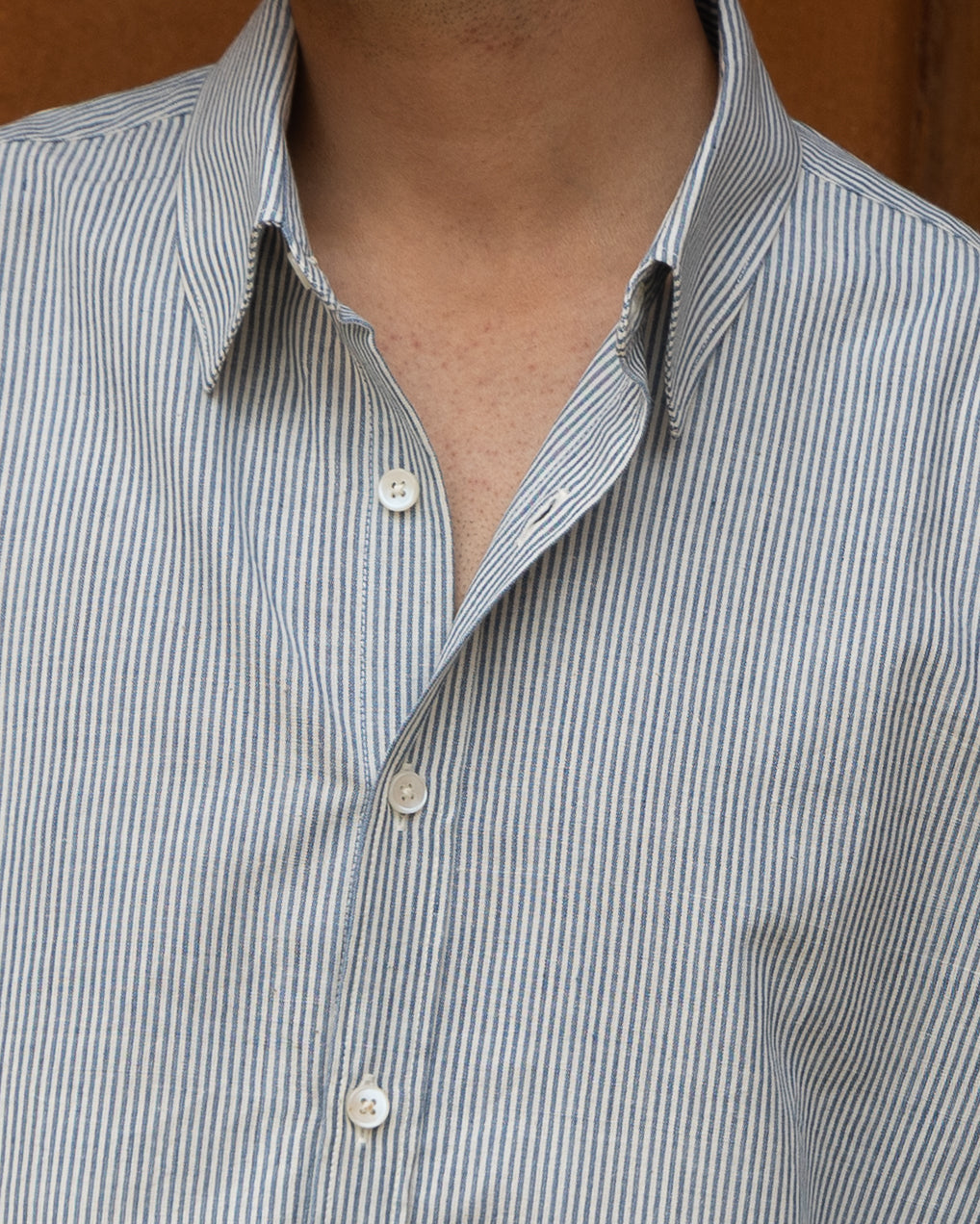 Light and breathable relaxed fit shirt in pastel blue tones, crafted from handspun khadi cotton and traditional handloom techniques.