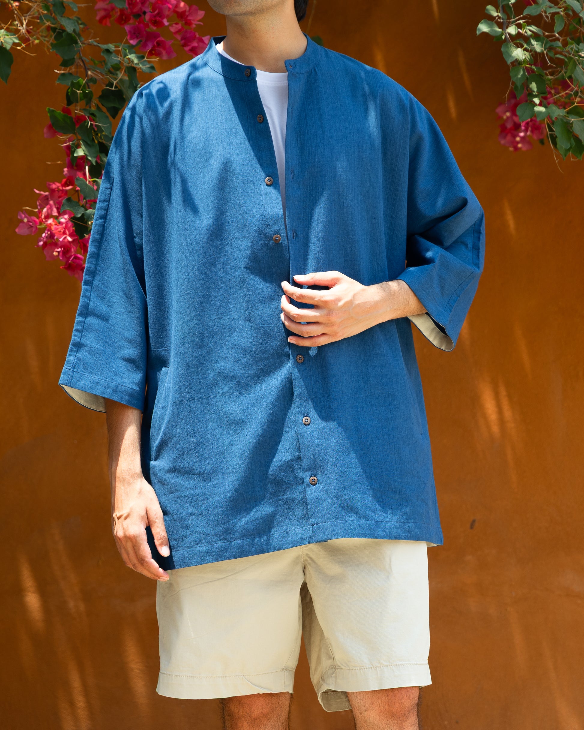 Handloom deep blue kimono sleeve shirt made from Khadi cotton, perfect luxury organic cotton shirt for men in earthy tones.

